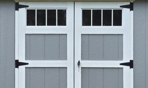 Custom shed door with transom window built in Halifax, Massachusetts showcasing craftsmanship and design.