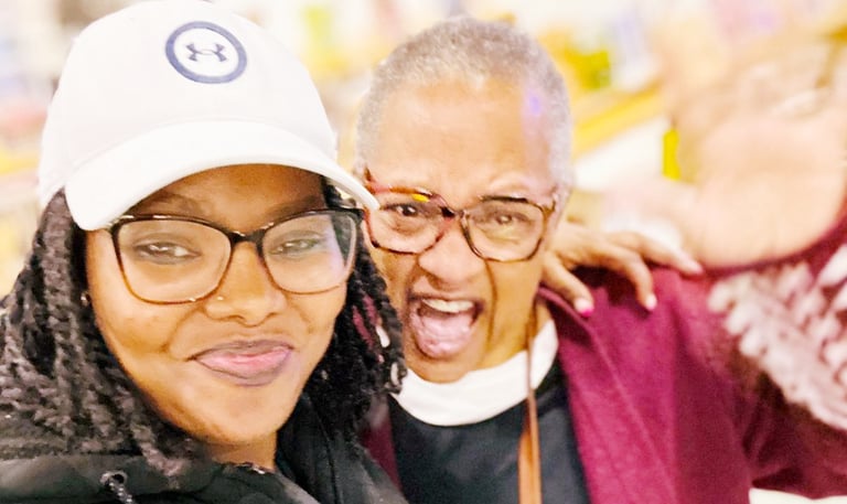 a woman with glasses and a hat on a white background
