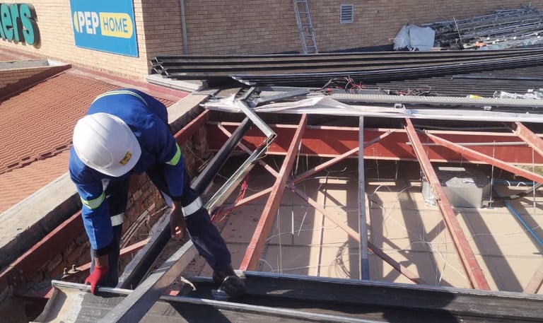 Environmental Pro Construction team replacing a roof structure on a commercial building in West Rand