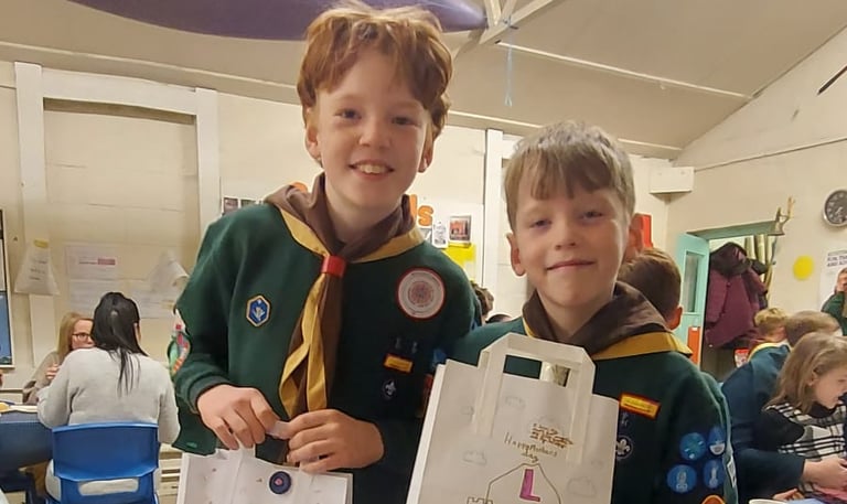 Cub Scouts smiling inside the 25th Allerton Scout Hut in South Liverpool