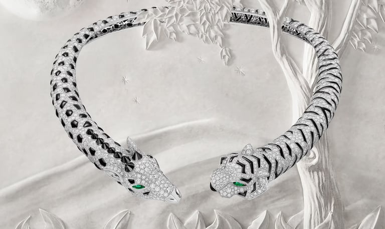 Signature Cartier Panthère bracelet with diamond and onyx design.
