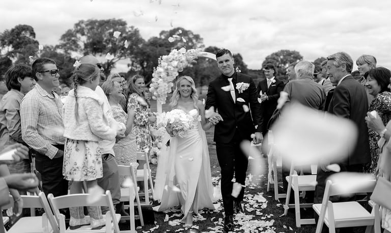 bride and groom petal toss