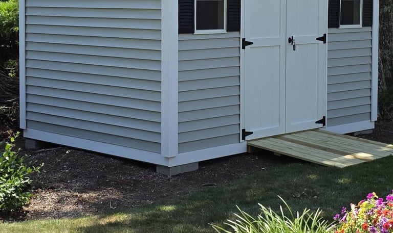 Decorative frieze bottom trim on custom shed built in Massachusetts, enhancing shed appearance with elegant finishing detail.