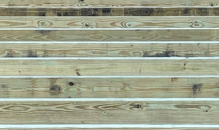 Pressure-treated 2x6 floor joists spaced 16" on center for maximum shed durability and long-term structural support