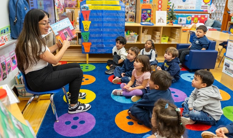 teacher reads aloud to class