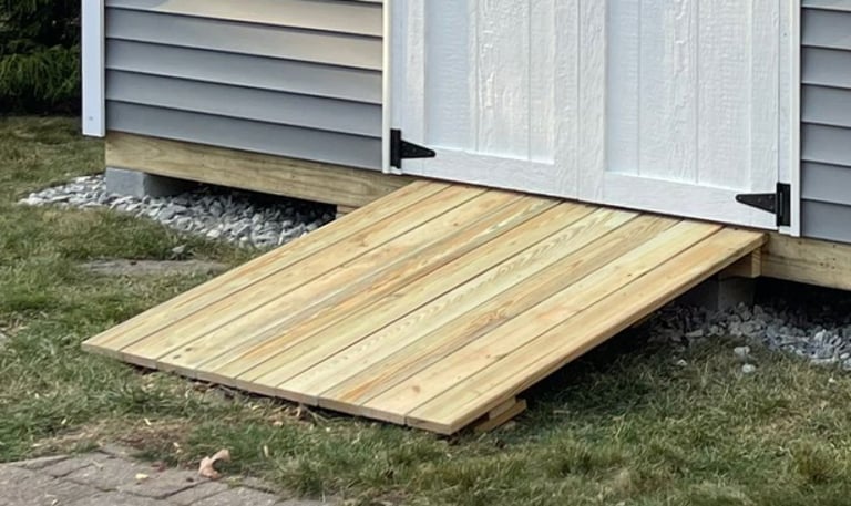 Standard pressure treated shed ramp built in Rhode Island for easy entry and accessibility.