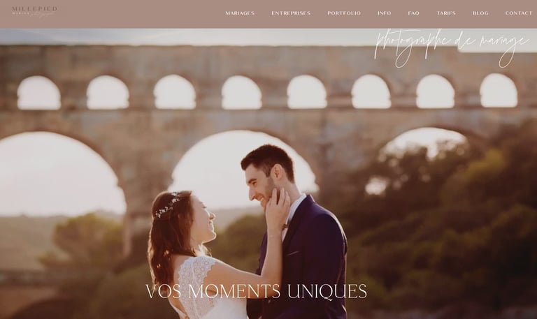 Wedding couple smiling at sunset with the historic Pont du Gard bridge in the background.