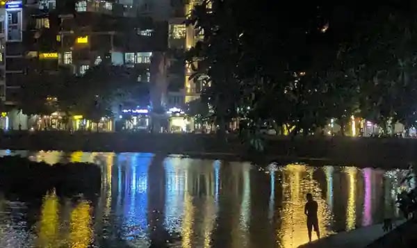 Night fishing at the lake in Hanoi Vietnam
