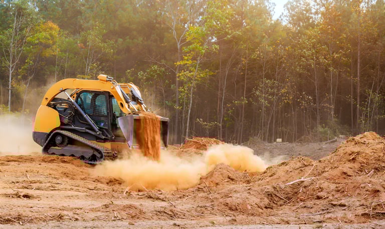 commercial land clearing and site preparation equipment working Gulf South construction site