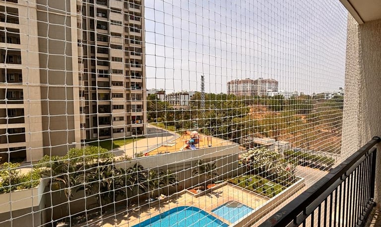 Wide shot of a modern apartment building on Altamount Road featuring discreet pigeon net installatio
