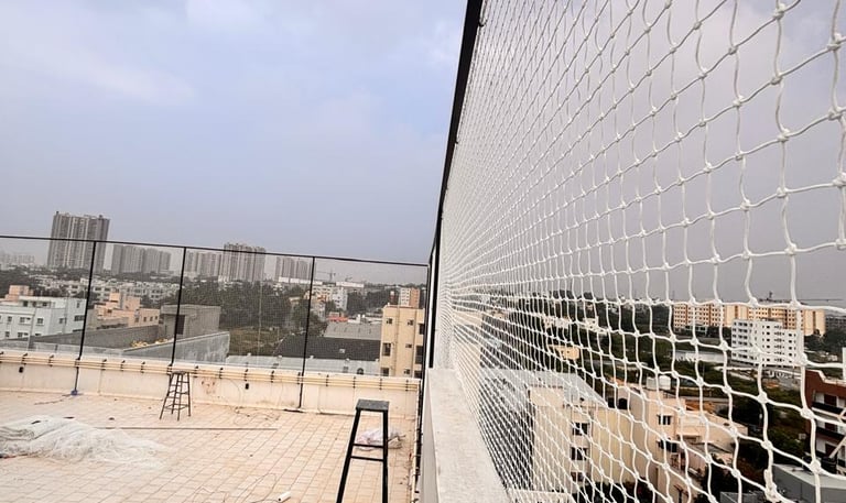 A freshly installed cricket net setup on a sunny day in a Chennai sports ground.