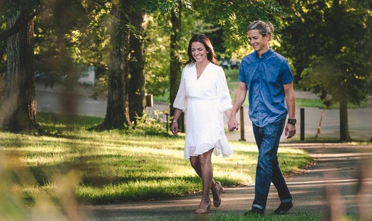 Man and woman holding hands walking