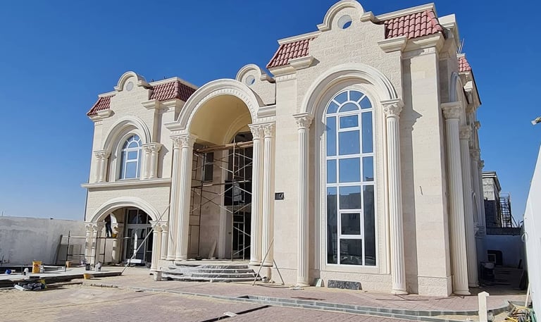 Grand villa with classical façade featuring arched windows, elegant columns, and aluminum framing, c
