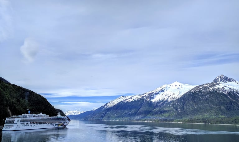 skagway Alaska mountains with cruise ship on water