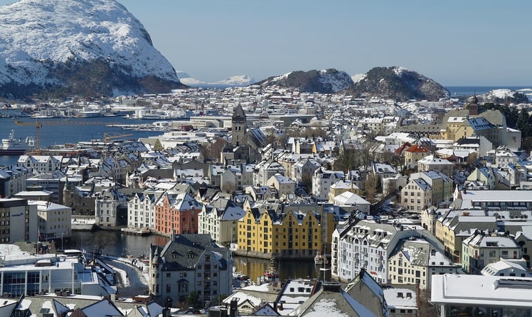 city of alesund Norway with mountains in background