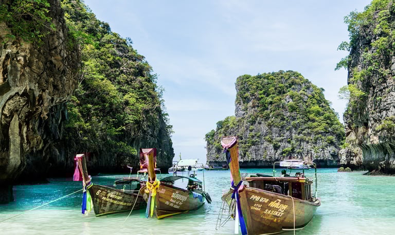 Ships in blue water near Phuket Thailand