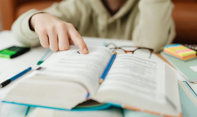 Photo by Photo By: Kaboompics.com: https://www.pexels.com/photo/close-up-of-a-person-reading-6958557