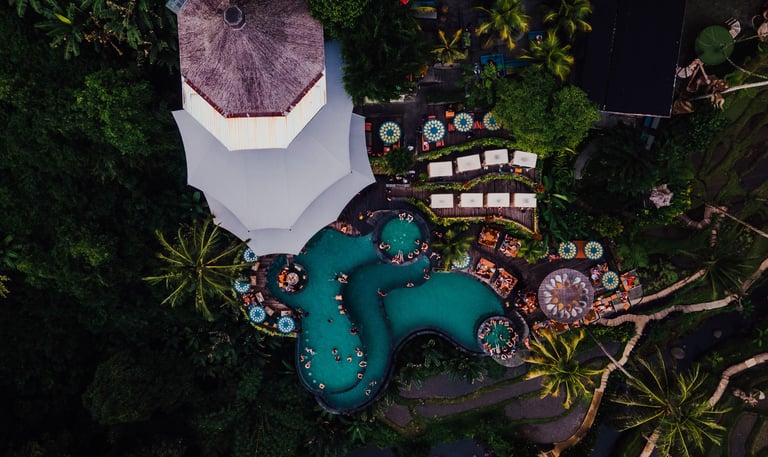 a pool with a view of a resort
