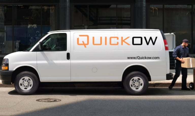 a man moving boxes into a truck