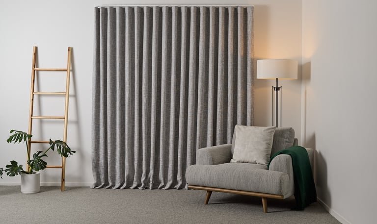 Product photography - a chair and ladder in a room with curtains