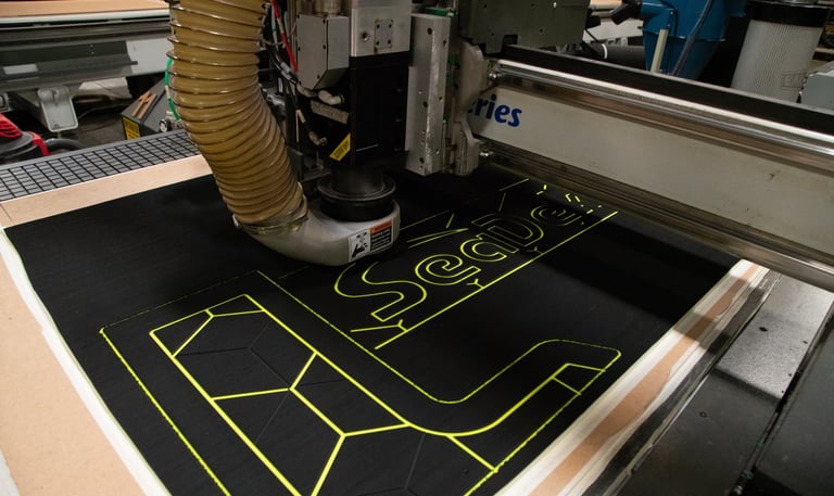 CNC machine cutting custom SeaDek flooring patterns for precise boat deck installation