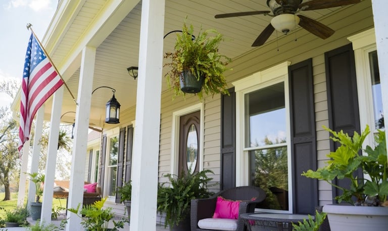 porch with white windows and black shutters