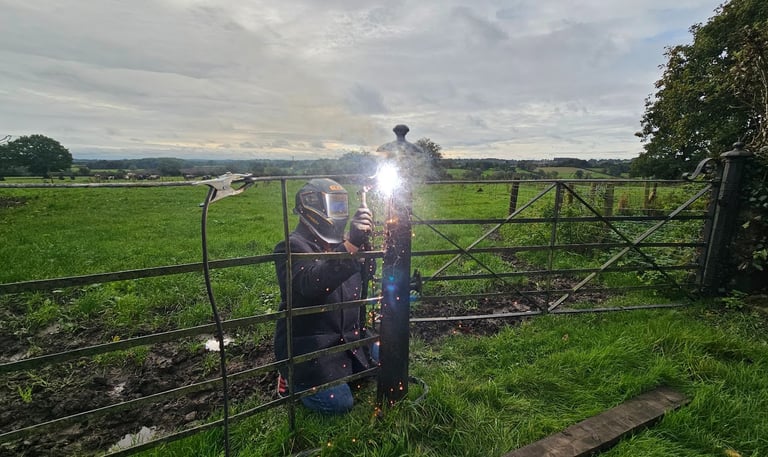 a person on site welding using a MIG welder