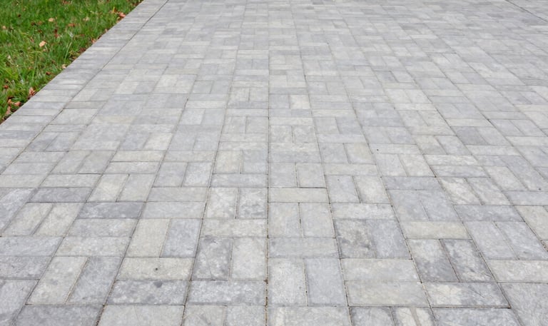 A freshly cleaned house exterior with sparkling windows and clear gutters under bright sunlight.