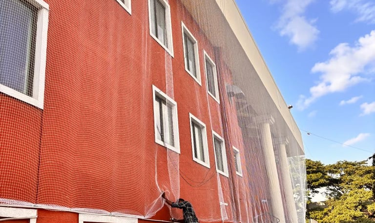 sturdy pigeon net tightly fitted around an apartment duct in Andheri West.