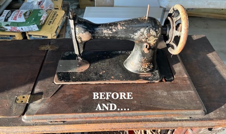 Vintage black cast iron sewing machine with rust on a wooden cabinet ready for restoration.