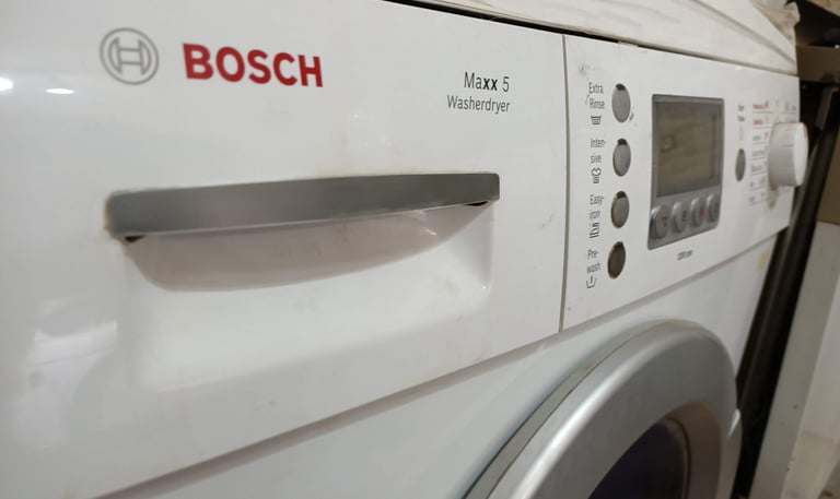 White Bosch Maxx 5 front-loading washer dryer featuring digital display and setting buttons.