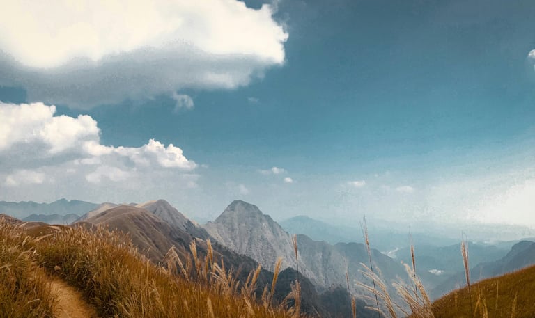 A pristine, open sky over the mountains, representing the freedom of authentic identity.