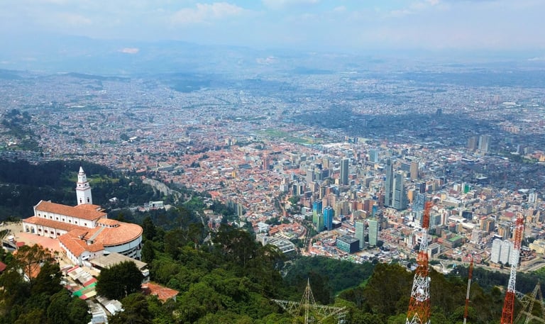 Panoramic aerial view of Bogota city skyline from the Monserrate sanctuary hilltop in Colombia.