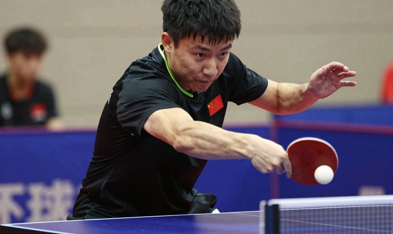 Sri Lankan table tennis coaches mentoring players during an outdoor training session under a bright sky.
