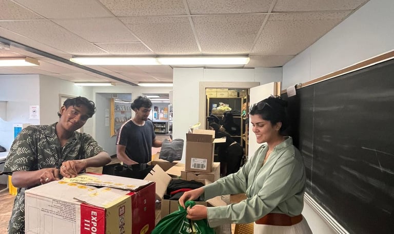 Volunteers organizing clothing for A Better Tent City