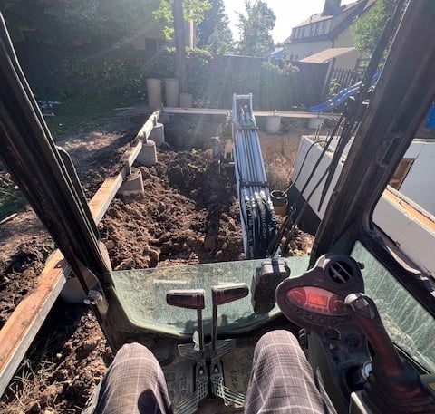 a person sitting in a truck with their feet up