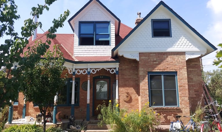 A classic 100 year old Victorian painted after 20 years of Colorado high mountain weather.