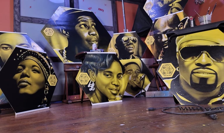Hip hop icons painted of boards for a school mural.