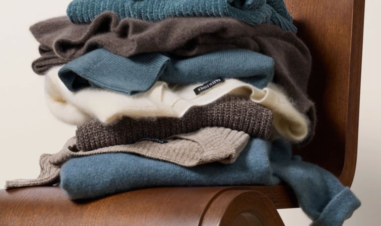 Rack of neutral-toned Eileen Fisher garments made from organic cotton and wool