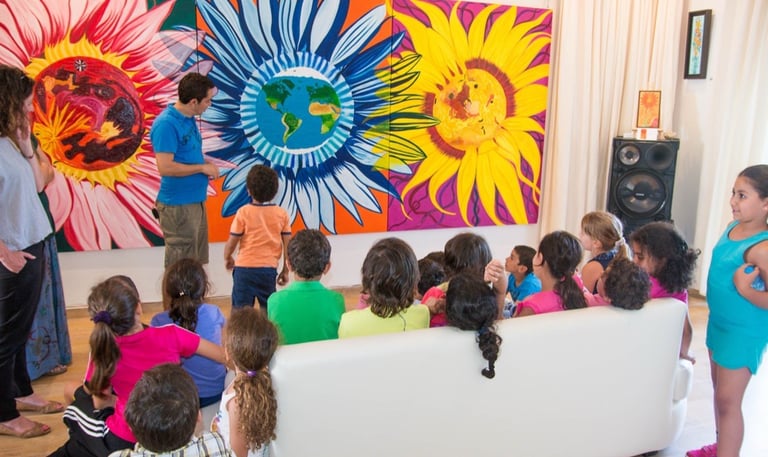 Artist Yous presenting this large triptique oil painting to the gallery visitors