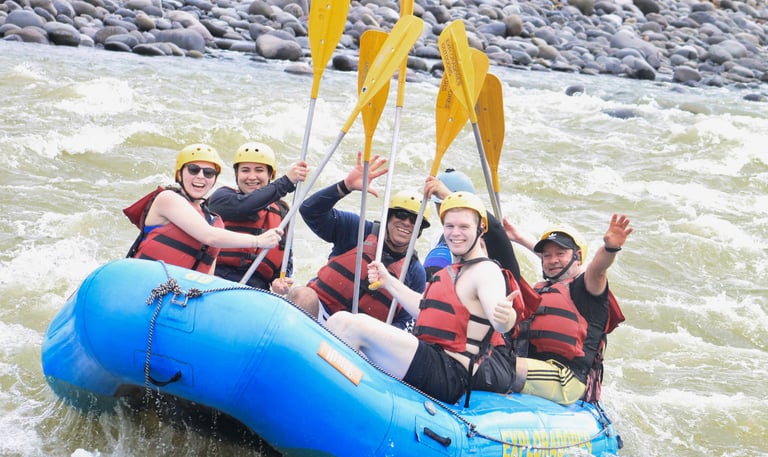 a group of people on raft raft raft rafting down a river