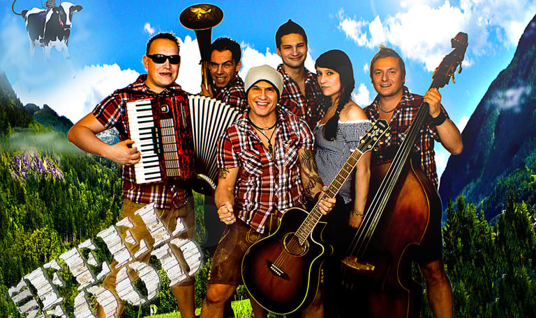 Stadlrogga aka Mr. Feelgood a group of people standing around a group of instruments