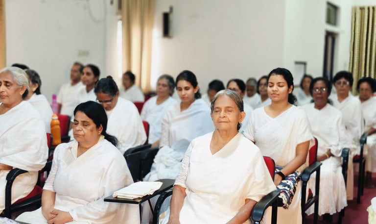 a group of people sitting in chairs in a room