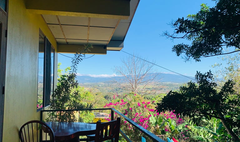 a table with a table and chairs on a balcony