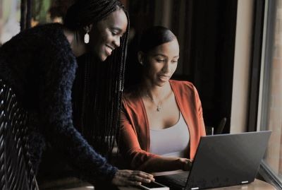 Young professional smiling with improved credit score