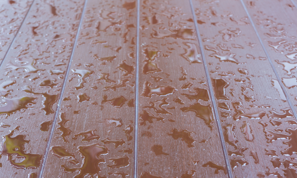 Water damage on hardwood floor in Coupland, TX home after indoor flooding
