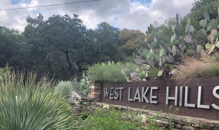 Water damage restoration company in Westlake Hills TX serving homes near local neighborhood sign