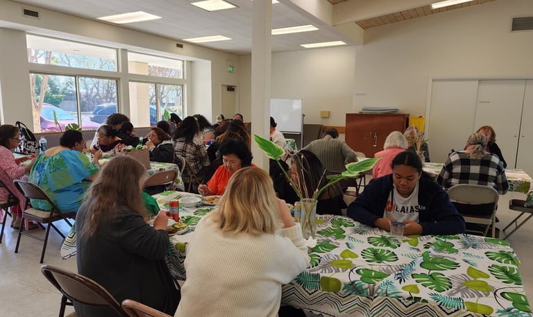 people gathered around table sharing a meal.