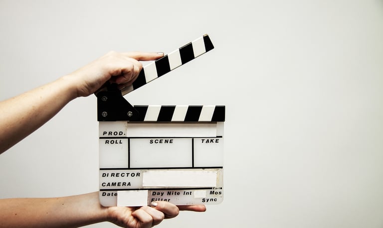 a person holding a clapper board