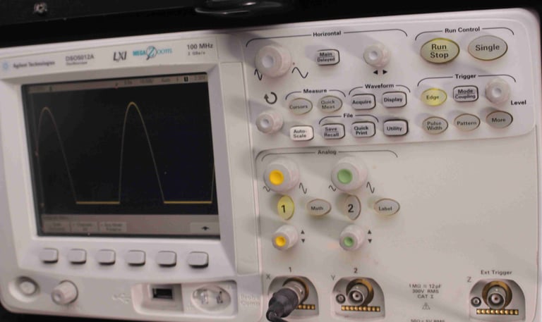 An oscilloscope being used to calibrate a camera PCB